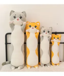 Detailed view of long cat plush pillows arranged neatly on a cozy bed, soft and cute.