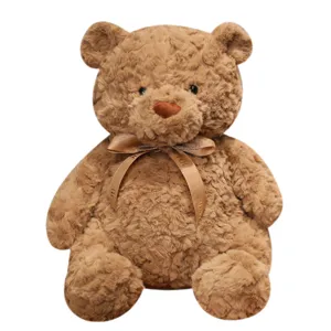 Cute brown plush teddy bear doll with ribbon bow, soft stuffed animal toy for kids gift.