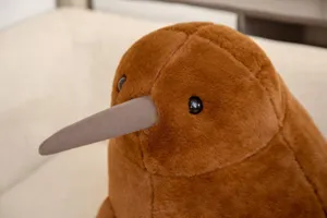Brown kiwi bird plush toy close-up, soft stuffed animal doll pillow for kids and home decor gifts.