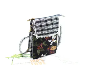 Detailed view of the multi-layer cotton crossbody phone bag with floral and plaid flap.
