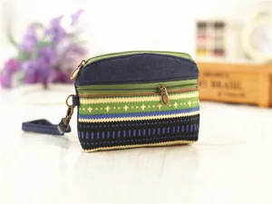 Ethnic style canvas coin purse with double zippers and wrist strap for daily use.