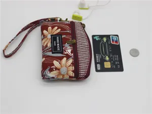 Floral print fabric coin purse with wrist strap and zipper closure, perfect for daily use.
