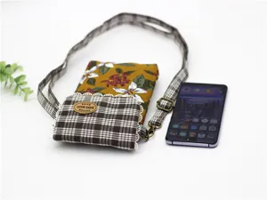 Cotton cross-body mobile phone bag with floral print and plaid pocket for women daily use.