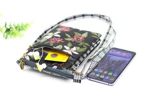 Floral canvas crossbody phone bag for women, multi-layer mini shoulder bag with strap.