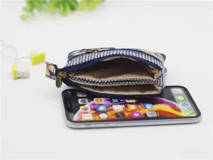 Multi-layer cotton coin purse with floral pattern and secure zipper closure for women.