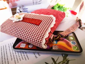Red and white houndstooth cotton linen cross body phone bag with lace and floral detail.