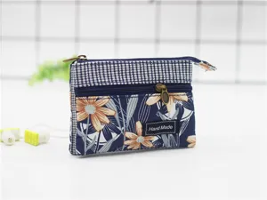 Multi-layer cotton coin purse with floral print and zipper closure for women daily use.