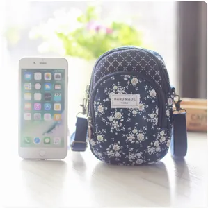 Gestreifte und geblümte Umhängetasche für Damen, kleine Handytasche mit verstellbarem Gurt.
