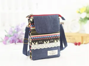 Ethnic style denim canvas crossbody phone bag with multi-layer design and adjustable strap.