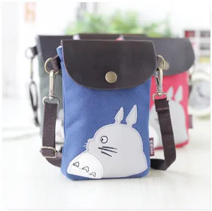 Canvas crossbody phone bag featuring cute Totoro embroidery, brown leather flap, and strap.