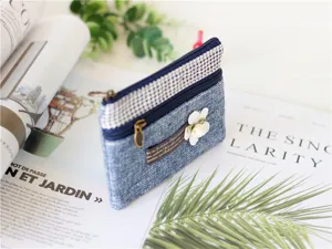 Blue denim fabric coin purse with double zippers, plaid patchwork and cute floral detail.