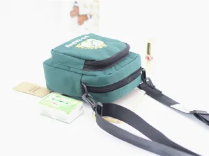 Green nylon crossbody bag with cute cartoon embroidery, multi-zipper compartments for women.