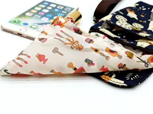 Detailed view of the multi-layer fabric crossbody phone bag with waterproof lining and cute prints.