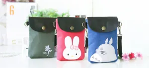 Canvas crossbody phone bag with leather flap and cute cartoon animal embroidery designs.