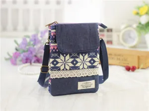 Ethnic denim cross-body phone bag with geometric snowflake pattern and lace trim detail for daily use.