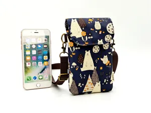 Waterproof cartoon bear print phone crossbody bag with adjustable strap for women.