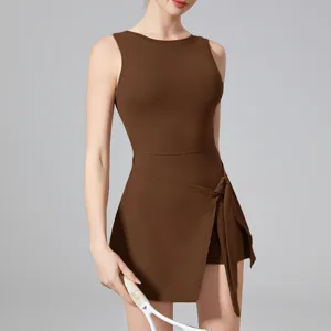Brown sleeveless activewear dress with built-in shorts for tennis and yoga workouts.