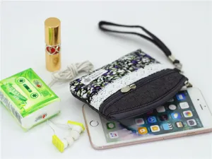 Floral print denim coin purse with wrist strap, cute small zipper pouch for women and girls.