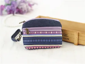 Cotton canvas coin purse with double zipper wrist strap and vintage ethnic stripe design.