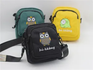 Nylon crossbody bag with cute cartoon embroidery, small casual shoulder phone bag for women.