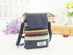 Close-up detail of ethnic style denim crossbody phone bag with multi-layer storage and strap.