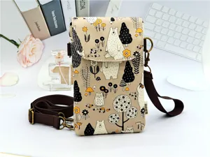 Detailed shot of cute cartoon bear print waterproof crossbody phone bag with adjustable strap.