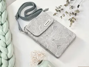 Detail view of grey leaf pattern fabric crossbody phone bag, adjustable strap, daily use.