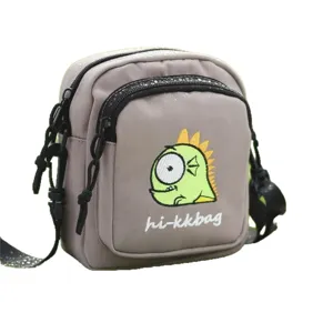 Grey nylon small crossbody bag for women, cute cartoon dinosaur embroidered shoulder phone bag.