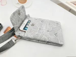 Canvas cell phone crossbody bag with leaf print, multi-layer stylish pouch for women.