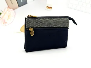 Piccolo portamonete in tela di cotone con tasche con zip multiple, borsa minimalista.