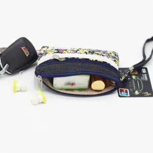 Floral denim coin purse with double zippers and strap, compact capacity pouch for daily use.