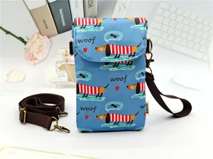 Cute dachshund print crossbody phone bag for women, waterproof fabric with adjustable brown strap.