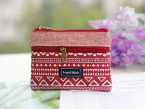 Red canvas coin purse with geometric white patterns and double zippers for daily use.
