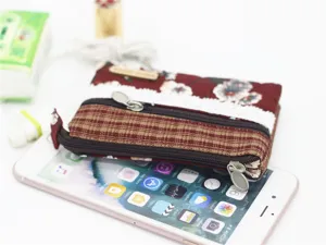 Detailed view of floral fabric multi-layer coin purse zipper pouch product display.