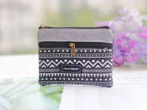 Small canvas coin purse with double zippers, stylish geometric pattern, portable pouch.