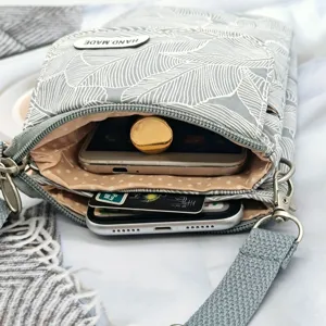 Floral leaf print fabric crossbody phone bag with multi-layer zipper pockets for women.