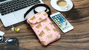Pink cute bear print crossbody phone bag detail view, multi-layer waterproof fabric design.