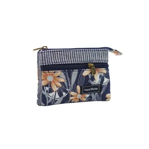 Floral cotton coin purse with multi-layer zipper design, compact and stylish fabric wallet.