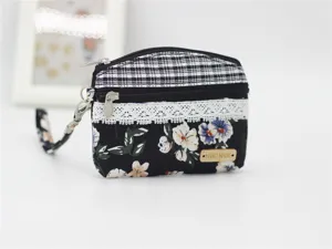 Floral print canvas coin purse with double zipper, wrist strap and handmade wooden label.