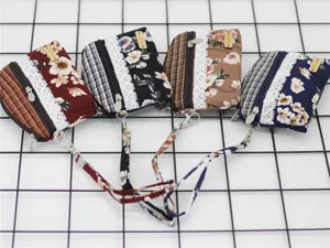Floral fabric coin purse with strap, lace trim and plaid pattern, multi-color detail view