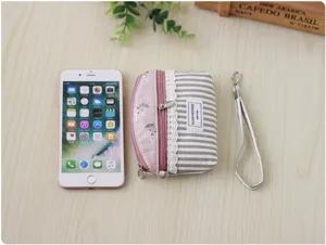 Korean style canvas coin purse with cute lace trim, double zipper and portable strap for daily use.
