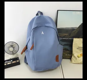 Casual light blue student backpack with letter print and stylish daily design for school.