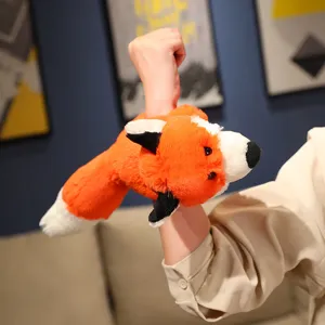 Cute plush fox slap bracelet detail shot, soft orange toy wristband for kids and gifts.