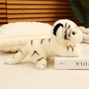 Detailed shot of a cute simulation white tiger plush toy in a prone posture, soft and cuddly.