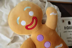 Detailed close-up view of the cute plush gingerbread man toy, showing soft fabric and embroidery.