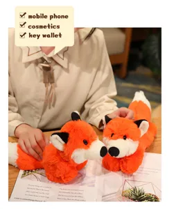 Detailed view of the adorable orange plush fox toy, featuring soft fur and charming design.