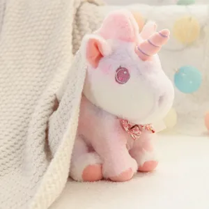 Detailed shot of a cute pastel unicorn plush toy with soft gradient colors and charming eyes.