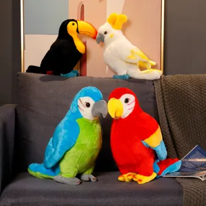 Detailed shot of cute plush parrot and toucan toys sitting together on a cozy gray sofa.