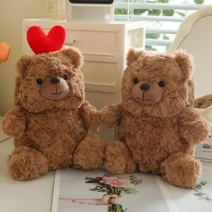 Cute brown plush teddy bear backpack soft toy with red heart detail for girls gift daily use.