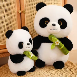 Close-up detail shot of cute plush panda toys holding bamboo with flowers, soft toy collection.